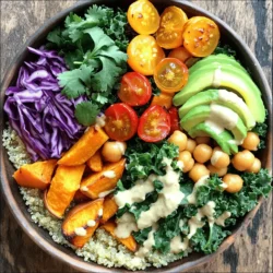 For a Vegan Buddha Bowl, you need simple, fresh items. Here is your shopping list: - 1 cup quinoa, thoroughly rinsed - 2 cups vegetable broth (low-sodium recommended) - 1 can (15 oz) chickpeas, drained and rinsed - 1 medium sweet potato, peeled and diced into 1-inch cubes - 1 cup kale, stems removed and chopped into bite-sized pieces - 1 ripe avocado, sliced - 1/2 cup cherry tomatoes, halved - 1/4 cup red cabbage, finely sliced - 2 tablespoons tahini - 2 tablespoons freshly squeezed lemon juice - 1 tablespoon pure maple syrup - 1 teaspoon garlic powder - 1 teaspoon smoked paprika - Sea salt and freshly ground black pepper to taste - Fresh cilantro leaves, for garnishing Each ingredient brings its own benefits. Here’s what they offer: - Quinoa: High in protein and fiber. It is a complete protein source. - Chickpeas: Packed with protein and help keep you full longer. - Sweet Potato: Rich in vitamins A and C for healthy skin and eyes. - Kale: Loaded with vitamins K, A, and C. Great for bones and immune health. - Avocado: Contains healthy fats that are good for your heart. - Cherry Tomatoes: Full of antioxidants. They help fight inflammation. - Red Cabbage: High in vitamins and has anti-cancer properties. - Tahini: Made from sesame seeds, it provides healthy fats and protein. - Lemon Juice: Rich in vitamin C, which boosts your immune system. - Maple Syrup: A natural sweetener that offers some minerals. You can swap ingredients based on your taste or what you have. Here are some ideas: - Quinoa: Use brown rice or farro for a different grain. - Chickpeas: Try black beans or lentils for added protein. - Sweet Potato: Substitute with butternut squash or regular potatoes. - Kale: Spinach or Swiss chard work well as leafy greens. - Tahini: Use peanut butter or sunflower seed butter if needed. - Lemon Juice: Lime juice can add a nice twist to your dressing. Feel free to mix and match based on your preferences. This recipe is flexible, making it fun to create your perfect bowl! For the full recipe, check out our detailed instructions. Start by rinsing your quinoa well. This removes bitter saponins and makes it taste better. Drain the quinoa thoroughly to avoid excess water. Next, peel and dice your sweet potato into 1-inch cubes. This size helps them cook evenly. Remove the stems from the kale and chop it into bite-sized pieces. For the cherry tomatoes, simply slice them in half. Finally, slice your avocado right before serving to keep it fresh and green. To cook quinoa, use a medium saucepan. Bring 2 cups of vegetable broth to a boil. Then, add your rinsed quinoa. Cover the pot and reduce the heat to low. Let it simmer for about 15 minutes. After that, check if all the liquid is absorbed. The quinoa should look fluffy. Remove it from the heat and let it sit for 5 more minutes, covered. This step gives it a great texture. Preheat your oven to 425°F (220°C). Spread the diced sweet potatoes on a lined baking sheet. Drizzle with olive oil. Sprinkle garlic powder, smoked paprika, salt, and pepper over them. Toss the sweet potatoes well to coat them evenly. Roast for 20-25 minutes, flipping halfway through. They should be tender and golden brown. This roasting brings out their natural sweetness. For the full recipe, check out the complete guide. Enjoy the vibrant flavors and textures in every bite! To make your Buddha bowl pop, use bright colors. Arrange the ingredients in sections. Each color adds beauty and invites eating. Use a variety of textures, like crunchy cabbage and creamy avocado. Choose contrasting bowls that enhance the colors of your meal. Dressings can elevate your bowl. A tahini dressing works well. Mix tahini, lemon juice, and maple syrup for a sweet and tangy taste. You can also add a drizzle of balsamic glaze for a rich touch. For crunch, sprinkle sesame seeds or chopped nuts. Fresh herbs like cilantro or parsley can add brightness. Meal prep saves time. Cook a large batch of quinoa and store it in the fridge. Roast sweet potatoes ahead and keep them in an airtight container. You can assemble your bowl quickly on busy days. Keep toppings like avocado and tomatoes fresh by adding them just before serving. This way, your meal stays colorful and tasty. For the full recipe, check the main article for guidance on making this dish easily. {{image_4}} You can use many grains in your Buddha Bowl. Quinoa is great, but you can switch it up. Try brown rice for a chewy texture. Farro adds a nutty flavor, while barley brings a hearty bite. You can even use millet or couscous for a unique twist. Each grain offers different nutrients and flavors to explore. Chickpeas are a fantastic protein source. If you want more options, consider black beans or lentils. Edamame is another quick choice full of protein and flavor. You can also use tempeh or tofu for a meatier texture. Adding nuts or seeds can give your bowl an extra protein boost while adding crunch. Incorporating seasonal veggies makes your Buddha Bowl fresh and colorful. Use asparagus or peas in spring. Summer brings ripe tomatoes and zucchini. In fall, roasted pumpkins or butternut squash shine. Winter is perfect for hearty greens like kale or Swiss chard. Choose what’s freshest to enjoy the best flavors and nutrients. For the full recipe, check out the complete guide on creating your Vegan Buddha Bowl! Store your Vegan Buddha Bowl leftovers in an airtight container. This will keep the food fresh. Place the quinoa, veggies, and dressing in separate containers. This helps maintain texture and flavor. Use the leftovers within three days for the best taste. If you have extra roasted sweet potatoes, they can last for about four days in the fridge. You can freeze some Buddha Bowl ingredients for later use. Quinoa freezes well. Just let it cool, then place it in a freezer-safe bag. It can last for up to three months in the freezer. Roasted sweet potatoes also freeze nicely. You can freeze them on a baking sheet first, then transfer to a bag. Chickpeas can be frozen too. Just drain, rinse, and dry them before freezing. When reheating, avoid using the microwave if possible. Instead, use a skillet on low heat. Add a splash of water to help steam the ingredients. This keeps your bowl moist and flavorful. For quinoa, you can reheat in a saucepan with a bit of water. Stir occasionally until heated through. If you have dressing left, drizzle it on after reheating to keep it fresh. For the full recipe, check it out in the main article. A Vegan Buddha Bowl is a colorful meal in a bowl. It includes grains, veggies, and protein. You can mix any plant-based ingredients you love. This dish is healthy, filling, and visually appealing. It often has a base of grains like quinoa or brown rice. Then, you add roasted or fresh vegetables. You can also include legumes, nuts, or seeds for protein. A tasty dressing pulls it all together. Each bite is a delightful mix of flavors and textures. You can easily create a vegan Buddha bowl with leftovers. Start with a base of grains, like rice or quinoa. Look for leftover veggies in your fridge. Roasted or fresh, any leftover vegetables work well. You can also add beans or lentils for protein. If you have nuts or seeds, sprinkle them on top for crunch. For a dressing, mix olive oil, lemon juice, and your favorite herbs. This way, you use what you have while making a tasty meal. If you don't have tahini, try these easy swaps. Almond butter or peanut butter can work well. They give a nutty flavor and creamy texture. You can also use sunflower seed butter if you're nut-free. Greek yogurt is another option for a creamy dressing. If you want a lighter option, use avocado or a simple vinaigrette. Mix lemon juice, olive oil, and a bit of maple syrup. This will add flavor without tahini. In this blog post, I explored how to build a tasty vegan Buddha bowl. We covered key ingredients, helpful cooking tips, and fun variations. You learned how to use different grains and proteins for better nutrition. You can make your bowl attractive with the right dressings and toppings. Finally, remember that meal prep can make your week easier. A vibrant Buddha bowl not only nourishes but also excites your taste buds. Enjoy creating and customizing your own bowl!