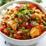 For this Slow Cooker Chicken Jambalaya, I use: - 1 lb boneless, skinless chicken thighs, diced into bite-sized pieces - 1 cup long-grain white rice, rinsed and drained - 1 can (14.5 oz) diced tomatoes, including juice - 1 bell pepper (your choice of color), diced - 1 medium onion, finely chopped - 2 cloves garlic, minced - 1 cup low-sodium chicken broth These ingredients form the base of the dish. The chicken gives a hearty protein, while the rice absorbs all the flavors. The diced tomatoes add moisture, and the bell pepper and onion bring color and crunch. To make this dish pop, I use: - 1 tablespoon Cajun seasoning - 1 teaspoon dried thyme - 1 teaspoon smoked paprika - Salt and freshly ground black pepper, to taste The Cajun seasoning is key. It adds heat and depth. Dried thyme and smoked paprika bring earthy notes that make the dish feel warm and comforting. Adjust salt and pepper to your taste for the perfect balance. For a finishing touch, I like to add: - 1 cup frozen peas - 2 green onions, thinly sliced (for garnish) The peas add a burst of color and a sweet taste. Green onions give a fresh crunch that brightens the dish. These garnishes take your jambalaya from good to great! {{ingredient_image_2}} To start, grab a large bowl and place your diced chicken thighs inside. Sprinkle in the Cajun seasoning, dried thyme, smoked paprika, and a pinch of salt and black pepper. Mix well until every piece of chicken gets coated with the spices. This step adds depth to the dish. Next, transfer the seasoned chicken into your slow cooker. This is where the magic happens. Now, it's time to add more flavor. Pour in the rinsed long-grain white rice. Then, add the can of diced tomatoes, including all the juice. Don't forget your diced bell pepper and finely chopped onion. Toss in the minced garlic for that aromatic touch. Finally, mix in the low-sodium chicken broth. Stir gently to combine all the ingredients evenly. You have two options for cooking: on low or high. If you choose low, let it cook for 6 to 7 hours. If you’re in a hurry, the high setting takes 3 to 4 hours. Check that the chicken is fully cooked and the rice is tender. Thirty minutes before serving, add the frozen peas. Stir gently to allow them to heat up without getting mushy. This adds a nice pop of color and sweetness. Once the cooking time is up, taste your jambalaya. Adjust the seasoning with more salt, pepper, or Cajun seasoning if needed. Let it sit, covered, for about 10 minutes. This helps the rice absorb any leftover liquid for the best texture. Before you serve, garnish with freshly sliced green onions. This adds a burst of fresh flavor and a lovely finish to your dish. To bring out the best taste in your jambalaya, adjust the seasoning to your liking. Start with the recommended amounts of Cajun seasoning, salt, and pepper. Taste the dish at the end of cooking. You can always add more spices if needed. Using homemade broth can make a big difference. It adds rich flavor and depth that store-bought broth may lack. If you don't have homemade broth, choose a low-sodium store-bought option. This way, you control the salt level in your dish. Let your jambalaya rest for about 10 minutes after cooking. This step helps the rice soak up any extra liquid, creating a better texture. Pay close attention to the ingredient ratios. The right balance of chicken, rice, and veggies is key. Too much rice can make it dry, while too little can make it soupy. Follow the recipe for perfect results. Presentation matters! Serve your jambalaya in a large bowl and top it with sliced green onions. This adds color and freshness. Pair your dish with warm, crusty bread for a hearty meal. A side salad also works well to add some crunch and freshness. Enjoy the mix of flavors and textures! Pro Tips Marinade for Flavor: Allow the seasoned chicken to marinate for at least 30 minutes before cooking. This will enhance the flavor and make the chicken more tender. Rice Variations: For a heartier meal, consider adding a mix of brown rice and white rice. Just remember to adjust the cooking time as brown rice typically requires longer to cook. Vegetable Additions: Feel free to add other vegetables like zucchini, okra, or corn to customize your jambalaya and boost its nutritional value. Storage Tips: Leftovers can be stored in an airtight container in the refrigerator for up to 3 days. Reheat gently on the stovetop or in the microwave before serving. {{image_4}} You can swap the chicken for shrimp or sausage. Shrimp cooks fast and adds a sweet taste. Sausage gives a great smoky flavor. Both make the dish unique. For a vegetarian option, use chickpeas or mushrooms. They add protein and texture. You can choose different bell peppers. Red, green, yellow, or orange all work well. Each brings its own sweetness and color. You might also add zucchini or corn for more crunch. These veggies balance the dish and keep it fresh. Want it milder? Cut back on the Cajun seasoning. You can also skip the black pepper. If you like heat, add cayenne pepper or hot sauce. Just a little will boost the spice. Adjust to your taste for the perfect kick. After cooking, let the jambalaya cool down for about 10 to 15 minutes. This step helps keep the dish fresh. Place the jambalaya in airtight containers. I recommend using glass or BPA-free plastic containers. These containers keep the flavors locked in and avoid spills. You can reheat jambalaya with two main methods: stovetop or microwave. For stovetop, heat a pan over medium heat. Add a splash of broth or water to keep it moist. Stir often to avoid sticking. For the microwave, place a portion in a bowl. Cover it with a damp paper towel. Microwave for 1-2 minutes, stirring halfway through. Both methods ensure your jambalaya stays tasty and warm. To freeze jambalaya, allow it to cool completely first. Then, use freezer-safe bags or containers. Squeeze out any excess air in bags to prevent freezer burn. Label them with the date and contents. Jambalaya can stay good in the freezer for up to three months. For the best quality, try to eat it within two months. Cooking Slow Cooker Chicken Jambalaya takes about 6-7 hours on low or 3-4 hours on high. The low setting gives the flavors time to blend. The high setting is great for quicker meals. Always check that the chicken is fully cooked. The rice should be tender and absorb most of the liquid. Yes, you can make this recipe vegetarian! Swap the chicken for diced tofu or chickpeas. Use vegetable broth instead of chicken broth. For added flavor, include more veggies like zucchini or mushrooms. This way, you'll have a hearty, meat-free jambalaya. Long-grain white rice is best for jambalaya. It cooks evenly and stays fluffy. You can also use basmati rice for a fragrant twist. Avoid short-grain rice; it tends to get sticky. Ensure you rinse the rice well before cooking to remove excess starch. In this blog post, we explored a tasty slow cooker chicken jambalaya recipe. We covered key ingredients, spices, and easy steps for cooking. I shared tips to enhance flavor and texture, plus variations to suit your taste. Remember, you can adjust ingredients and spices to make this dish your own. Don’t forget the garnishes for a vibrant finish. Slow cooker jambalaya is simple and delicious, perfect for any meal. Enjoy creating your own version and sharing it with family and friends!